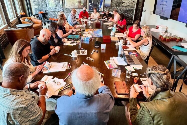 University Area CDC Executive Director and CEO Sarah Combs and the community nonprofit's Board of Directors take part in art therapy during a team retreat at the Oxford Exchange in Tampa