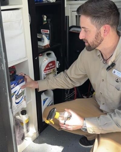 Danny Gallagher, with Hillsborough County Solid Waste Services, demonstrates how to store chemicals properly as a hurricane approaches.