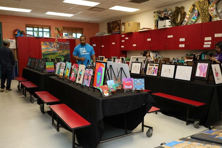 Artwork by Prodigy participants on display during a March 2024 showcase event at the University Area CDC Community Center