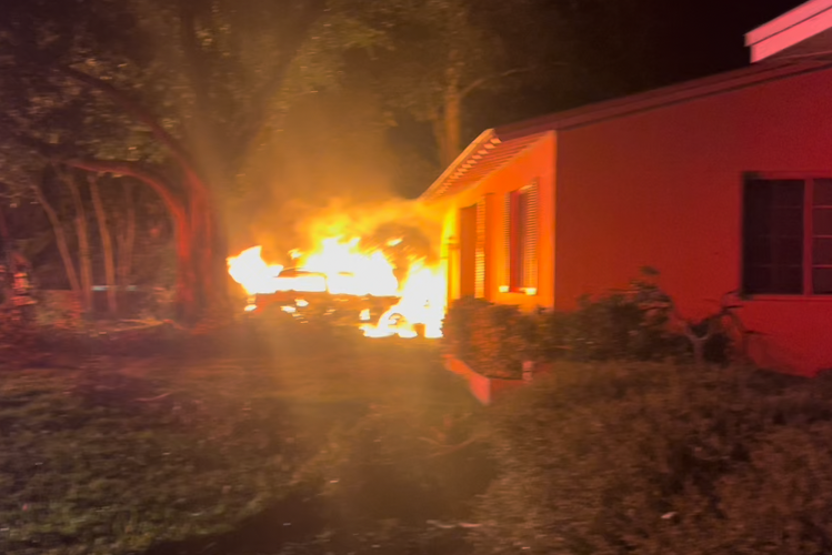 Dave Scheiber's neighbor's car burns during Helene