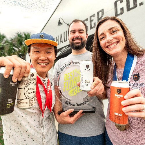 BarrieHaus co-founders Junbae Lee, Jim Barrie and Brittney Barrie raise a beer to being named Best Small Brewery of the Year at the 2024 Best Florida Beer Competition.
