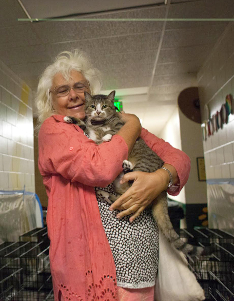 Daina Shukis checks out of an animal-friendly shelter in Lecanto due to Hurricane Matthew.