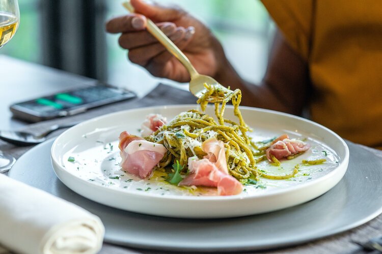 One of Pasta Pack’s newest menu items, spaghetti alla pesto with prosciutto di parma. The fresh spaghetti noodle is tossed in a pine nut pesto for an herby, nutty, and refreshing flavor.