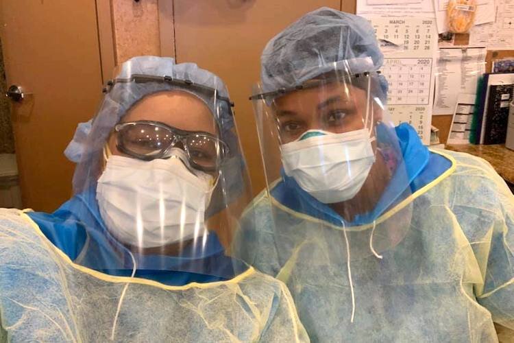 The plastic face shields add protection over fabric facemasks.