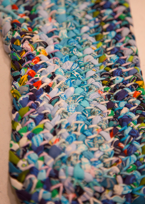 A handmade rag rug in the early stages created by MJ Baker.