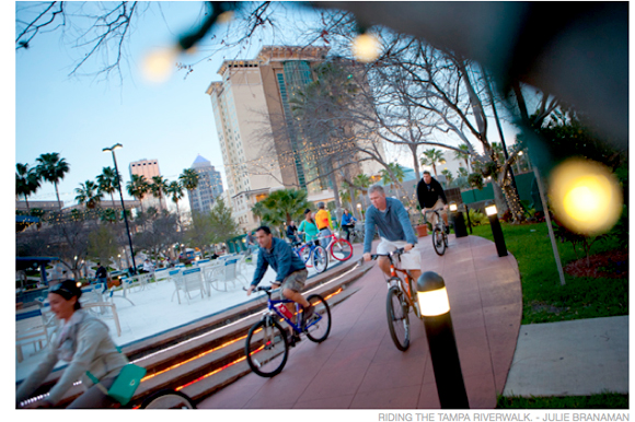 Cyclists on the Riverwalk in Tampa.