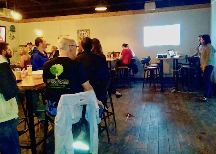 A moderator leads the discussion at Urbanism on Tap on Yellow Brick Row.