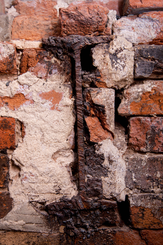 A cross-section of an old I-beam in the brick wall is one of many relics left from the building's industrial past.