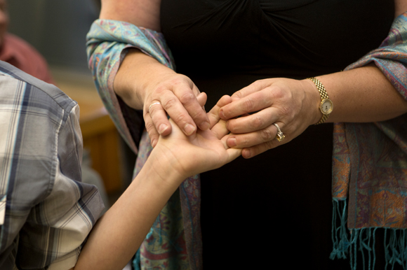 Kerstin Kenty holds her son Mathew's hand on the day his adoption is finalized.