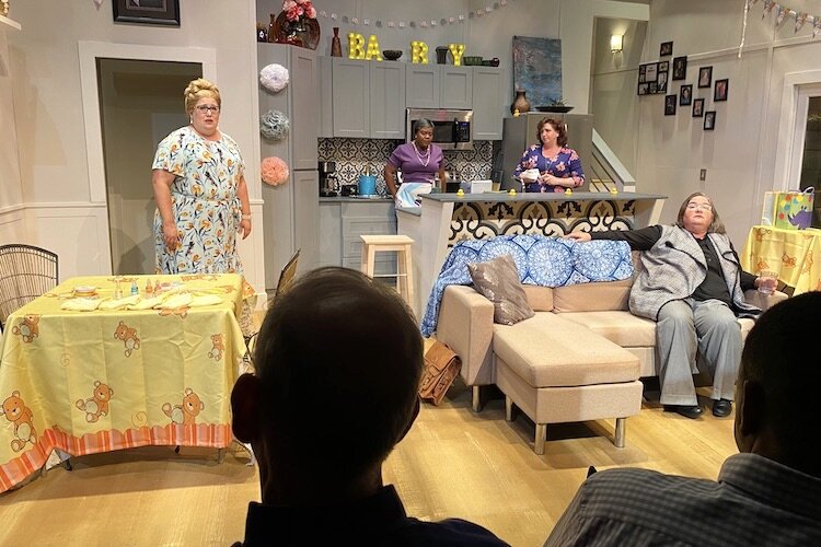Karla Hartley, Producing Artistic Director of Stageworks Theatre, is seated on the couch during a production of "Morningside'' in February 2020.