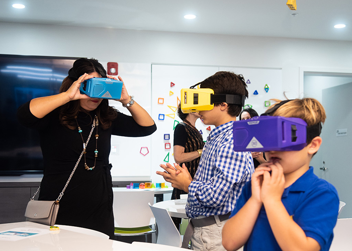 Students experiment with virtual reality goggles.