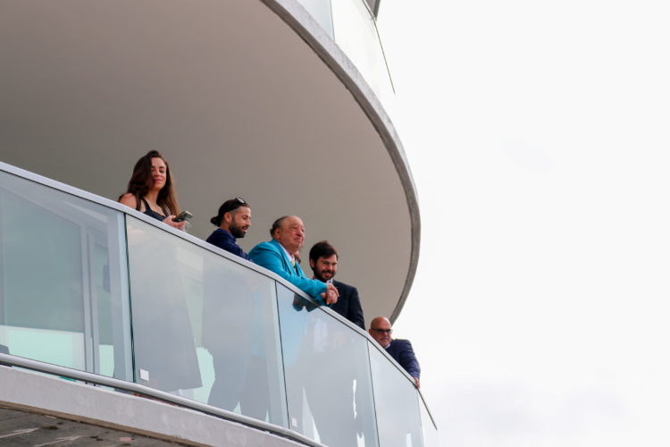 Red Apple Group founder and CEO John Catsimatidis Sr. and his family take in the view from a balcony at The Residences at 400 Central.