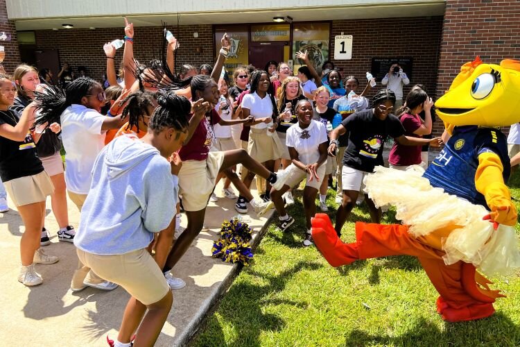 Tampa Bay Sun mascot Solé dances with students from Ferrell Girls Preparatory Academy