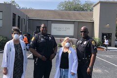 Denise Maguire, Marcus Elam, Marcia Johansson, and Ryan O'Neil distribute resources and assess family needs at an outreach event for the Sulphur Springs community at Abundant Life Church.