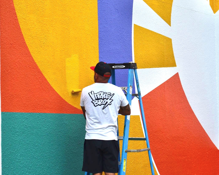 Vitale Bros. painted the mural "Rise and Shine" on the wall of Parc Center for Disabilities as a Bright S[ot Community Project during the SHINE Mural Festival.