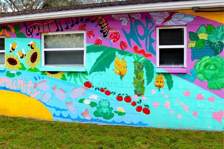 Vibrant mural art covers Harvest Hope Center